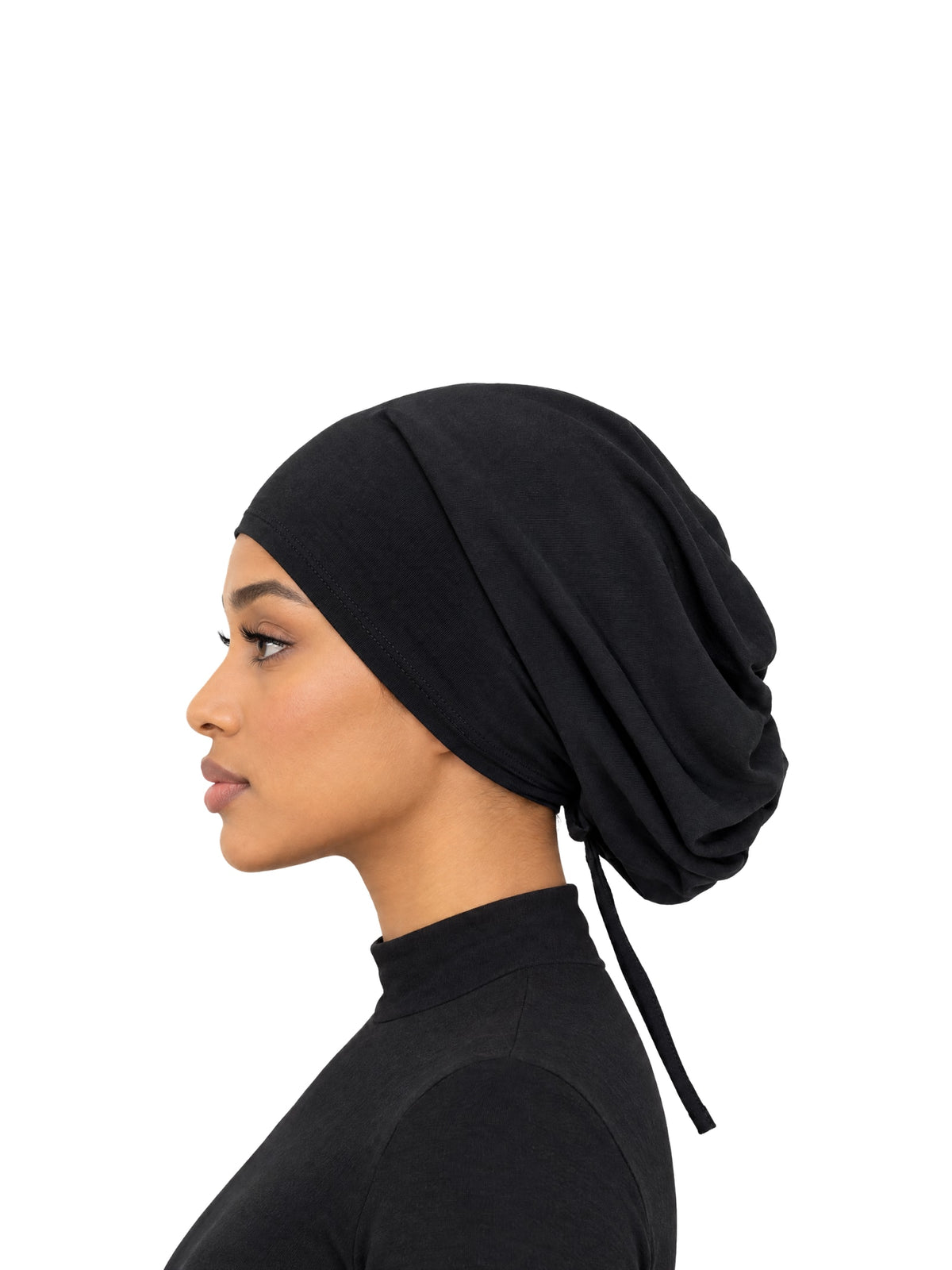 Imaarah Luxe Ruched Mod Cap in black, side view on model