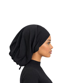 Imaarah Luxe Ruched Mod Cap in black, other side view on model