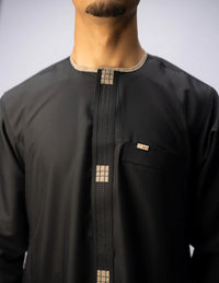 Amaani Dune Kids Collarless Thobe, Black, model wearing the matching men's Dune, collarless neckline and placket