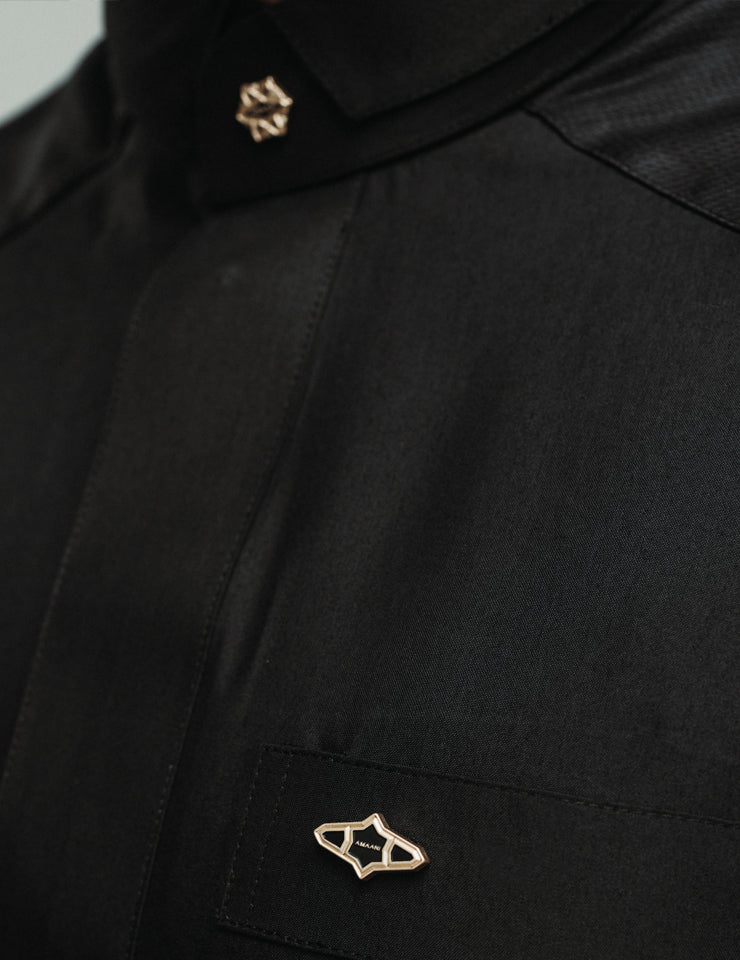 Amaani Stark Kids Designer Thobe, Black, collar, signature button and top pocket close up