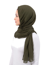 Green Imaarah Ninja Chiffon Shawl, side view, scarf draped around the shoulders
