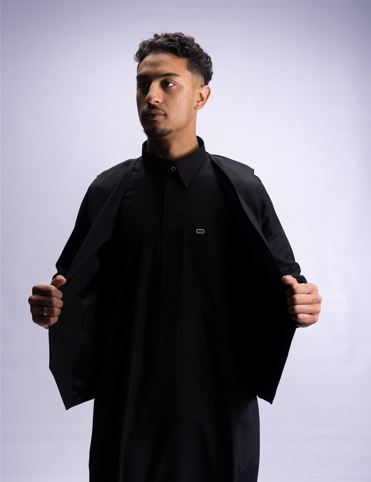 Amaani Ameer Thobe & Waistcoat Set, Black, model opening the waistcoat layer