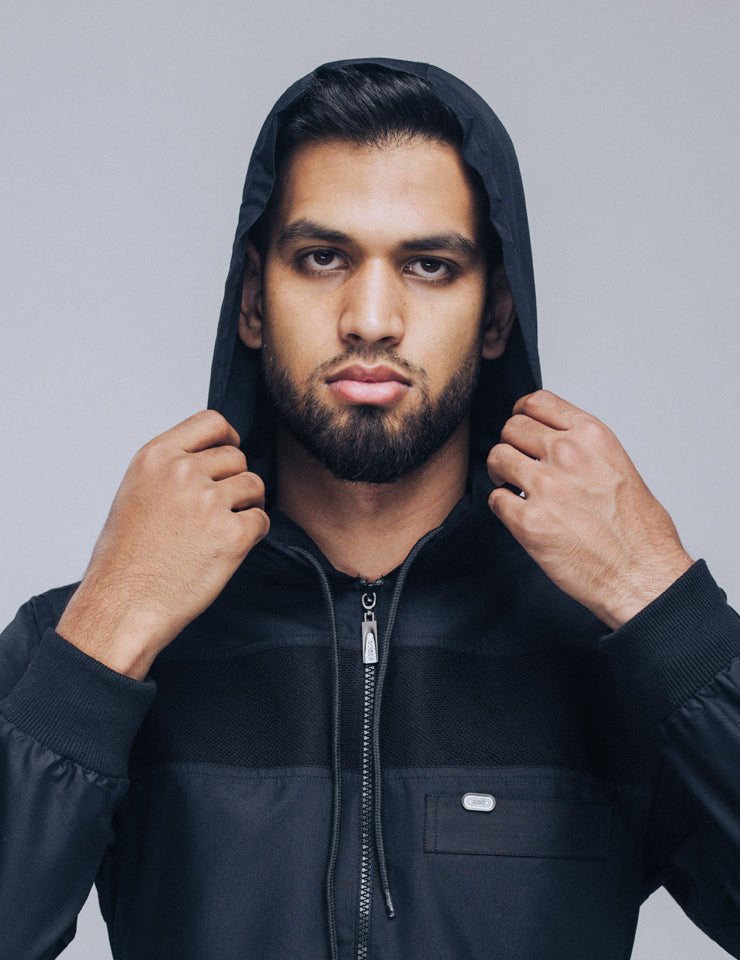 Amaani Drift Hooded Thobe, Black, model wearing hood up, front