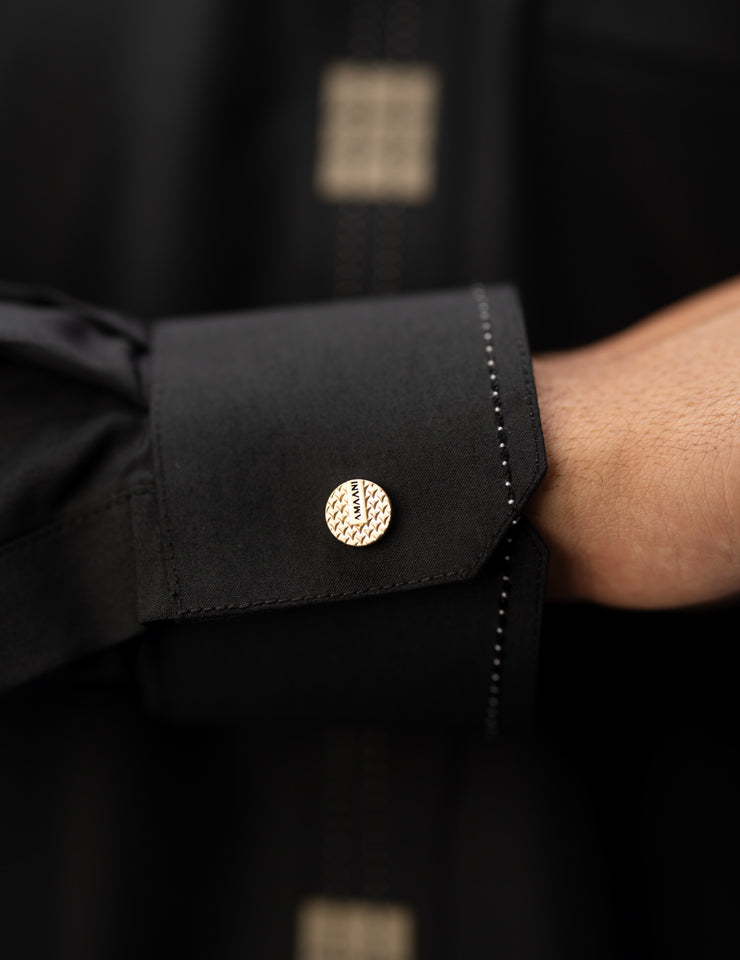 Amaani Dune Collarless Thobe, Black, cuff and signature button close up