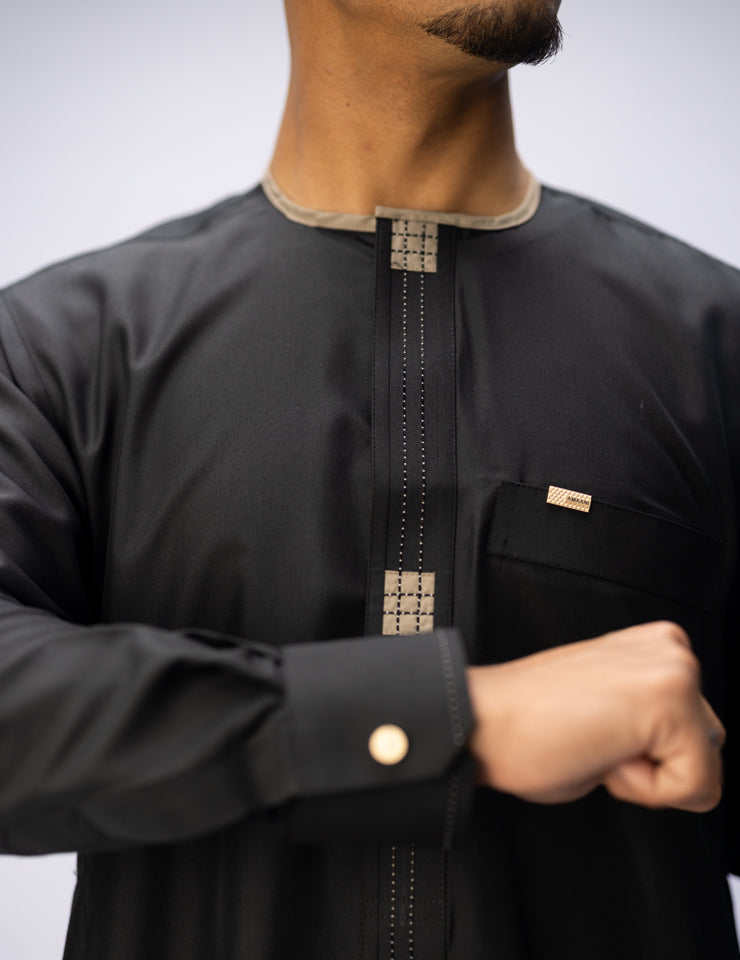 Amaani Dune Collarless Thobe, Black, intricate placket panel and top pocket on model
