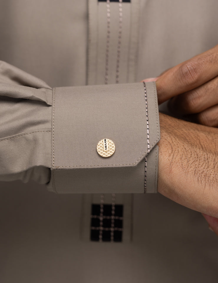 Amaani Dune Collarless Thobe, Beige, cuff and signature button close up
