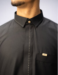 Amaani Iconic Black Thobe, Onyx Black, shirt collar and embroidered placket on model