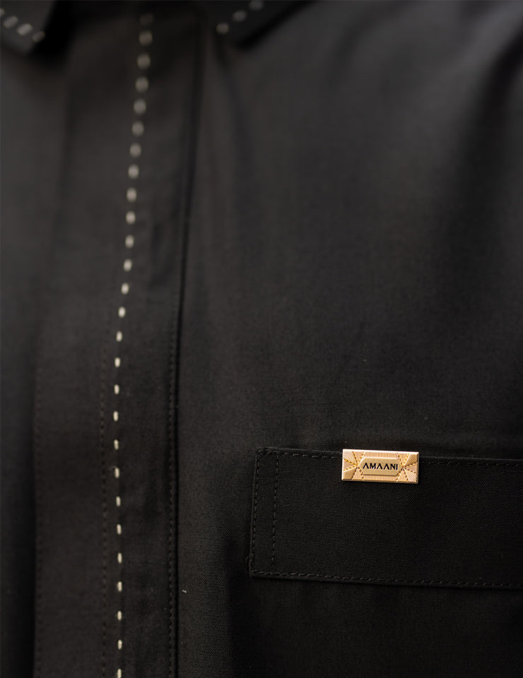 Amaani Iconic Black Thobe, Onyx Black, placket embroidery and top pocket close up