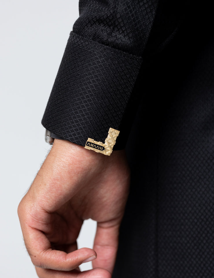 Amaani Nibras Textured Saudi Thobe, Black, tailored cuff and signature buttons close up