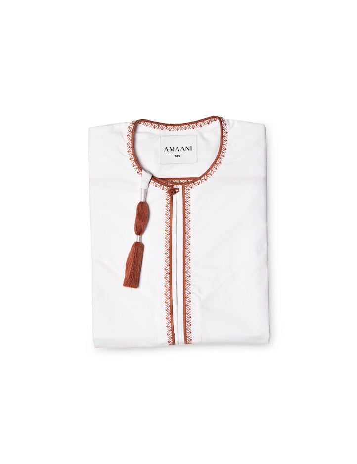 Amaani Omani Thobe, Desert Coral (White), folded flat lay showing coral placket embroidery and collar tassel