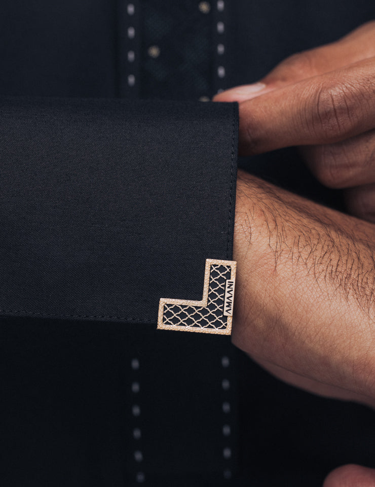 Amaani Onyx Saudi Collar Thobe, Black, cuff and signature button detail