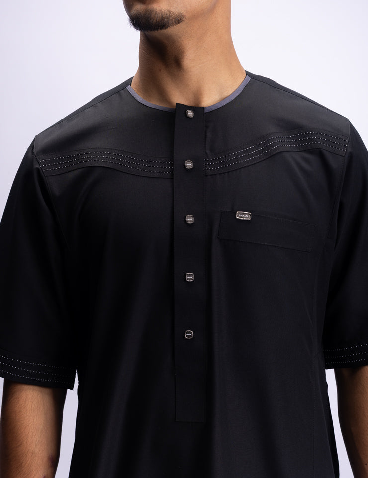 Amaani Silhouette Short Sleeve Thobe, Black, handcrafted yoke detailing on model