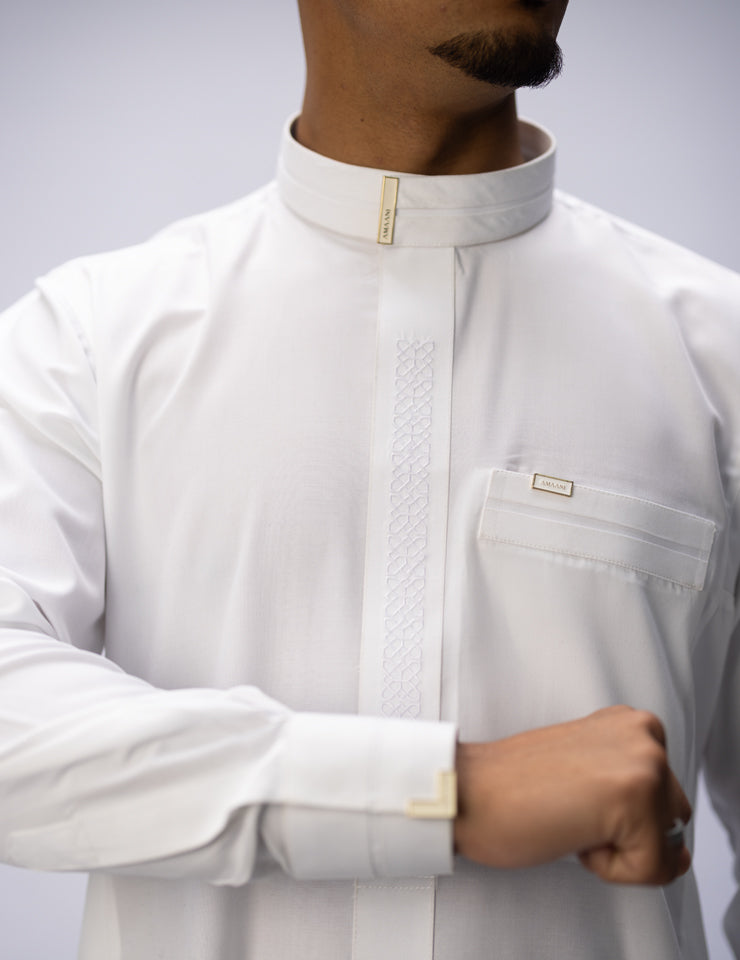 Amaani Sultan Saudi Thobe, Alabaster, tonal placket embroidery and top pocket on model